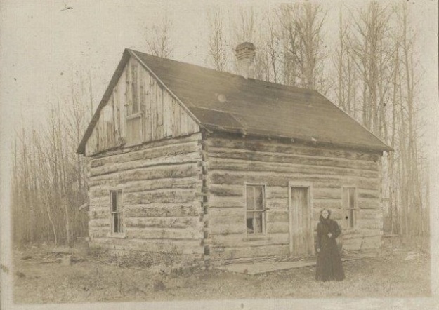Catherine Gillespie  in front of cabin